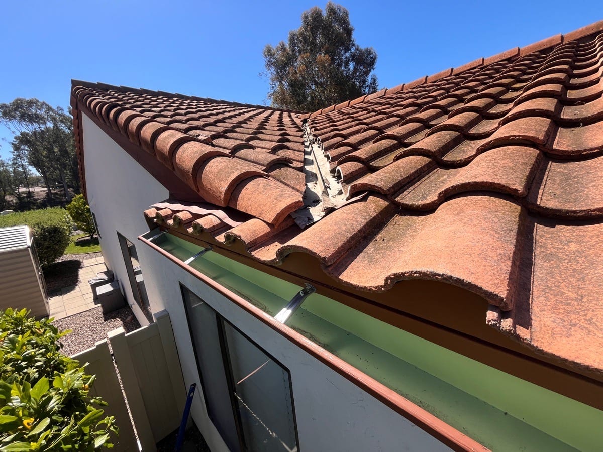 Completed roof-edge gutter installation documented on an AWC project